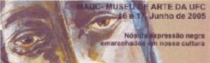 Imagem do catálogo da exposição "Nós Negros". Ao fundo o rosto de uma mulher em tons roxos, à frente texto de divulgação da exposição.